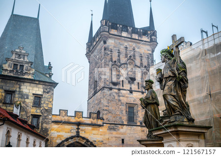 Mysterious Charles Bridge In Prague: Stone Statues Stand Sentinel Against The Historic Bridge Tower 121567157