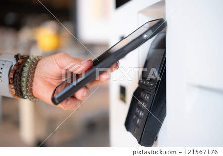 Girl Makes Contactless Payment With Smartphone At Nfc Terminal 121567176