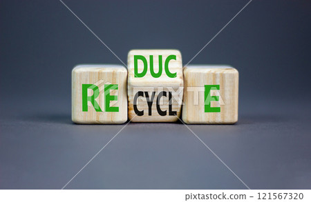 Reduce or recycle symbol. Concept words Reduce Recycle on wooden block. Beautiful grey table grey background. Business reduce or recycle concept. Copy space. 121567320