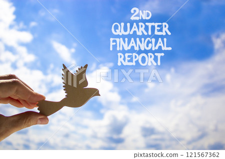 2nd quarter financial report symbol. Concept words 2nd quarter financial report. Beautiful blue sky and clouds background. Businessman hand. Business 2nd quarter financial report concept. Copy space. 121567362