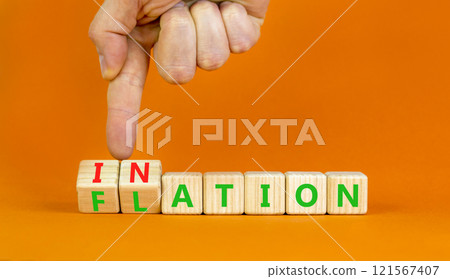 Flation or inflation symbol. Concept words Inflation or Flation on beautiful wooden blocks. Beautiful orange table orange background. Businessman hand. Business flation inflation concept. Copy space 121567407