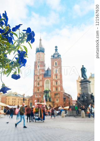 An ancient church of St. Mary with two towers on the central square of the European city of Krakow. 121567630
