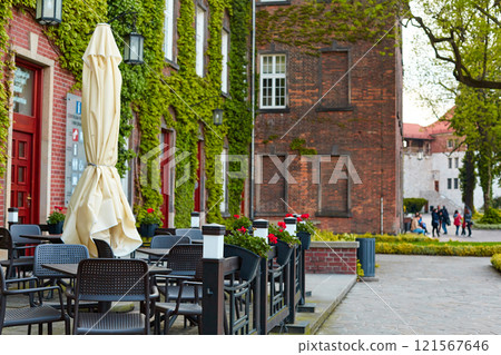 Cozy street restaurants on European streets in the center of Krakow. 121567646