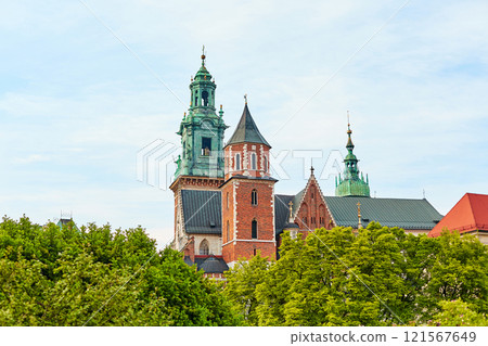 The courtyard is buried in flowers and greenery in the ancient Zamek Krolewski na Wawelu Castle in the center of Krakow. The courtyard is buried in flowers and greenery in the ancient Zamek Krolewski na Wawelu Castle in the center of Krakow. 121567649