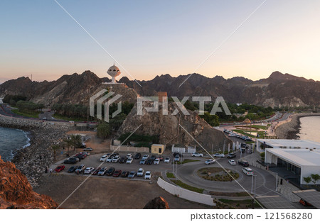 Riyam Incense Burner Monument in Muscat, Oman at Sunset with Mountainous Backdrop 121568280