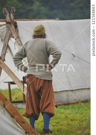Man in ancient clothing at a Viking festival in Denmark Man in ancient clothing at a Viking festival in Denmark 121568663