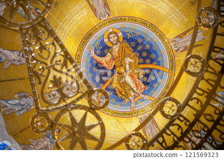 The interior of the Church of Saint Sava features an intricate dome adorned with gold and colorful mosaics depicting Christ. The interior of the Church of Saint Sava features an intricate dome adorned with gold and colorful mosaics depicting Christ. 121569323