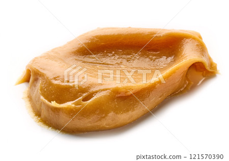 Smear of tasty caramel paste 121570390