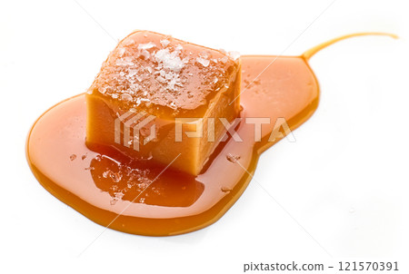 salted caramel candy in melted caramel sauc salted caramel candy in melted caramel sauc 121570391