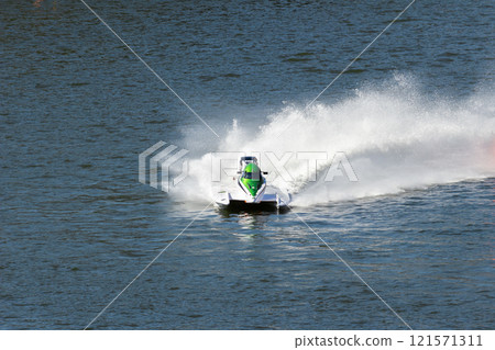 White Powerboat Making Turn on Water 121571311