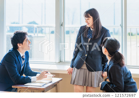 High school student talking happily with classmates in the classroom High school student talking happily with classmates in the classroom 121572697