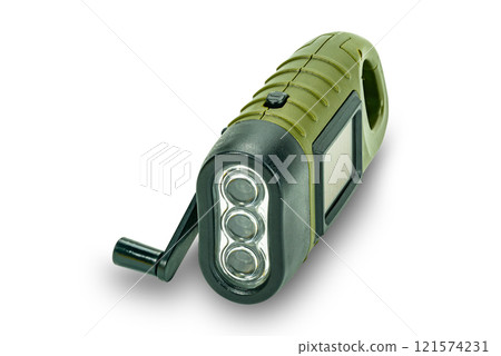 High angle view of mini solar cranking LED flashlight. 121574231