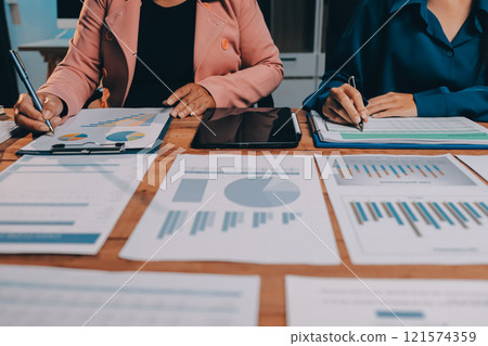 Business meetings to analyze investment strategies and brainstorm sales plans for a more profitable business. 121574359