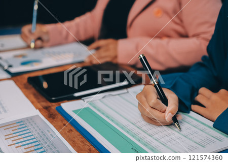 Business meetings to analyze investment strategies and brainstorm sales plans for a more profitable business. 121574360