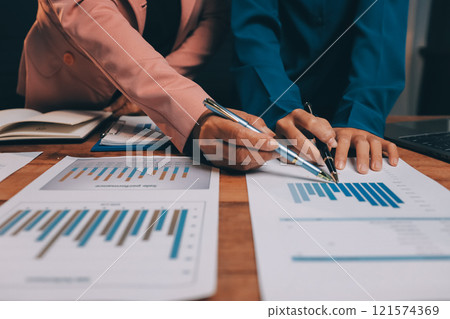 Business meetings to analyze investment strategies and brainstorm sales plans for a more profitable business. 121574369