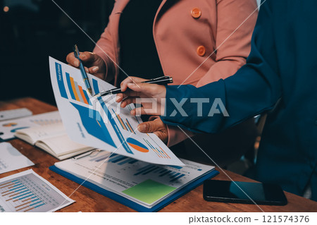 Business meetings to analyze investment strategies and brainstorm sales plans for a more profitable business. 121574376