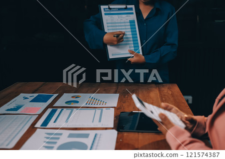 Business meetings to analyze investment strategies and brainstorm sales plans for a more profitable business. 121574387