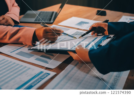 Business meetings to analyze investment strategies and brainstorm sales plans for a more profitable business. 121574390