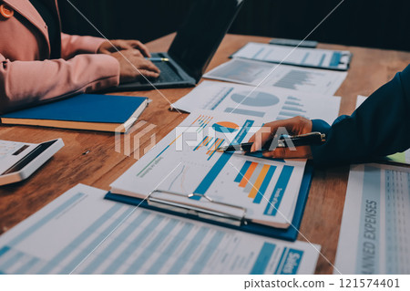 Business meetings to analyze investment strategies and brainstorm sales plans for a more profitable business. 121574401