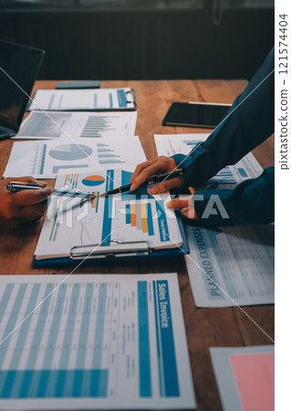 Business meetings to analyze investment strategies and brainstorm sales plans for a more profitable business. 121574404