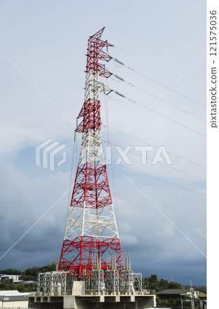 Low-angle view of the high voltage tower and electric line with the sky background. Low-angle view of the high voltage tower and electric line with the sky background. 121575036