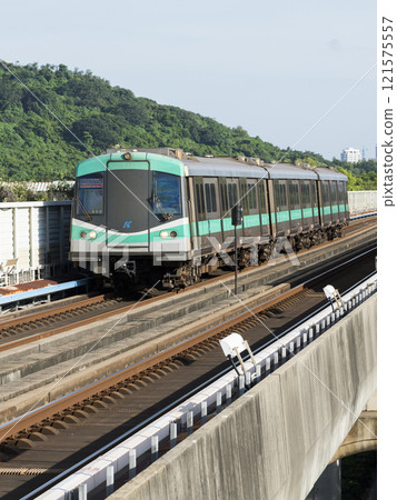 A Red Line train running on the elevated track of the Kaohsiung Rapid Transit System in Taiwan passes by the World Games metro station. 121575557