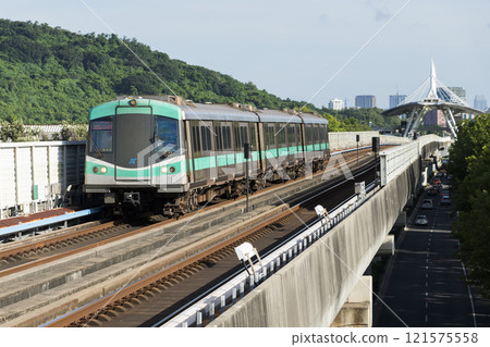 A Red Line train running on the elevated track of the Kaohsiung Rapid Transit System in Taiwan passes by the World Games metro station. 121575558