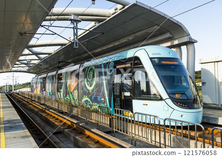 The Danhai Light Rail transit (LRT) train stops at Tamkang University Station in New Taipei City, Taiwan. 121576058