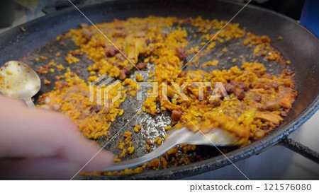 Deliciously Crispy Socarrat Paella Being Served 121576080
