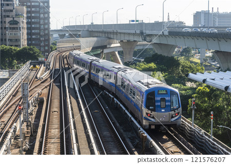View of a Taoyuan International Airport line train running on the elevated track of the Taoyuan Mass Rapid Transit System. 121576207