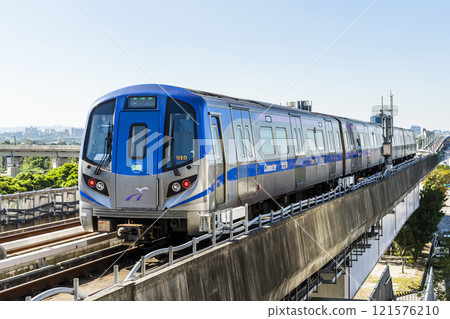 View of a Taoyuan International Airport line train running on the elevated track of the Taoyuan Mass Rapid Transit System. 121576210