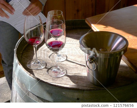 Wine on a barrel 121576656