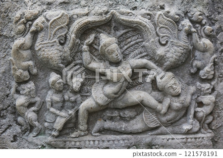 Decorative engraving of ancient tribes on a rock in the Danish zoo 121578191