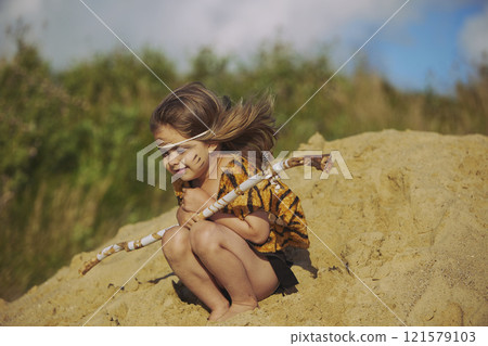Cute baby dressed in the clothes of primitive people Cute baby dressed in the clothes of primitive people 121579103