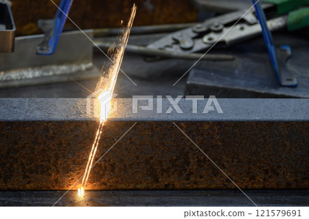 Close up scene rust cleaning process by portable laser cleaning machine. 121579691