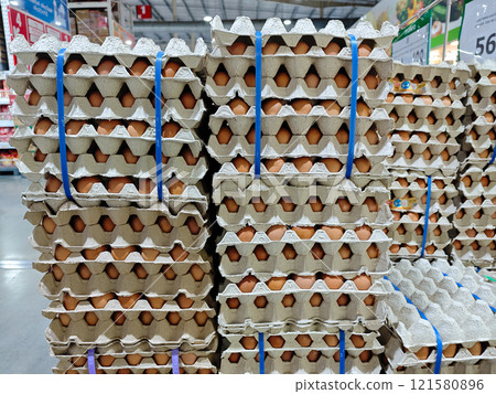 Fresh Eggs Stacked Neatly in Cardboard Cartons at Grocery Store Fresh Eggs Stacked Neatly in Cardboard Cartons at Grocery Store 121580896