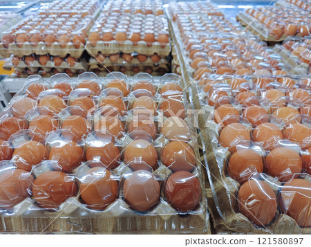 Fresh Brown Eggs in Transparent Packaging at Grocery Store Display Fresh Brown Eggs in Transparent Packaging at Grocery Store Display 121580897