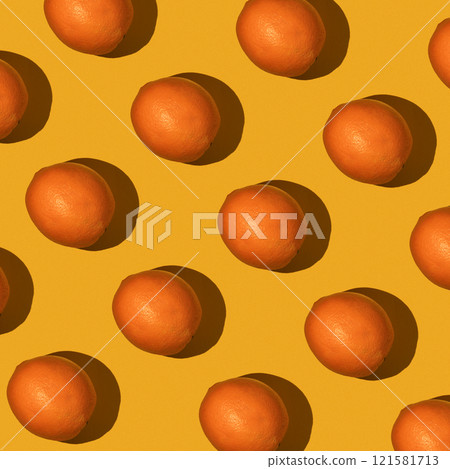 Fresh juicy whole orange on yellow background. Fruit pattern, summer concept. Flat lay Top view. Background with citrus fruits Fresh juicy whole orange on yellow background. Fruit pattern, summer concept. Flat lay Top view. Background with citrus fruits 121581713