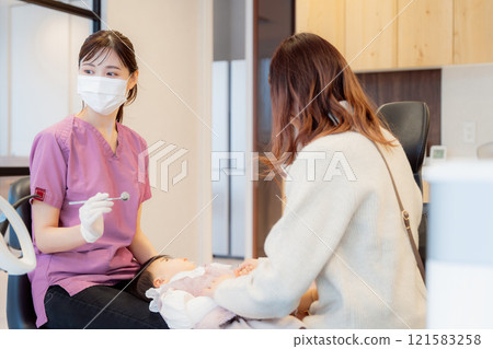 An anxious baby undergoing an infant checkup An anxious baby undergoing an infant checkup 121583258
