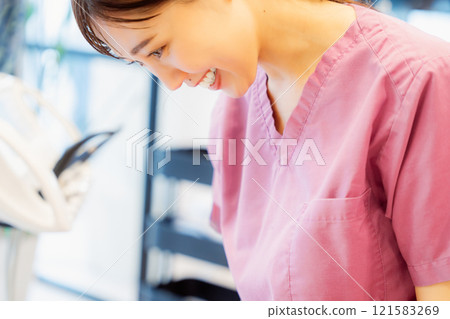 An anxious baby undergoing an infant checkup 121583269