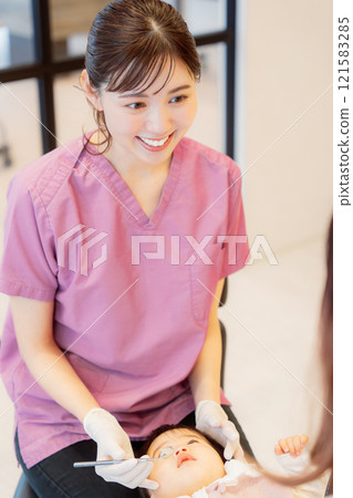 An anxious baby undergoing an infant checkup An anxious baby undergoing an infant checkup 121583285