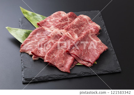Beef shoulder loin for sukiyaki on a black background 121583342