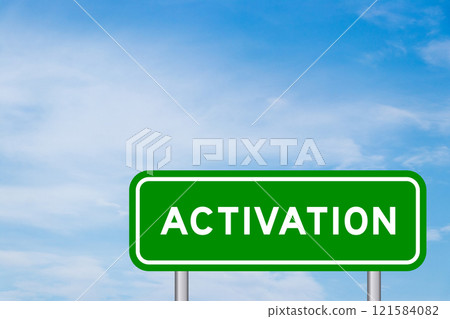 Green color transportation sign with word activation on blue sky with white cloud background 121584082