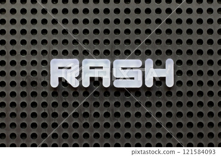 White color letter in word rash on black pegboard background 121584093