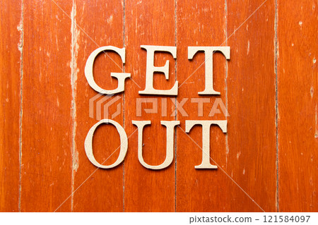 Alphabet letter in word get out on old red color wood plate background Alphabet letter in word get out on old red color wood plate background 121584097
