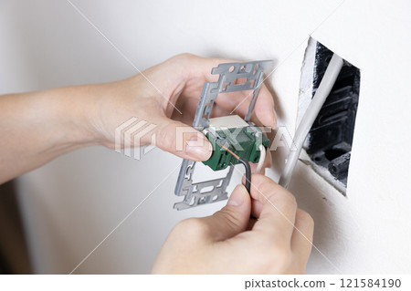 Removing the wires from an old light switch 121584190