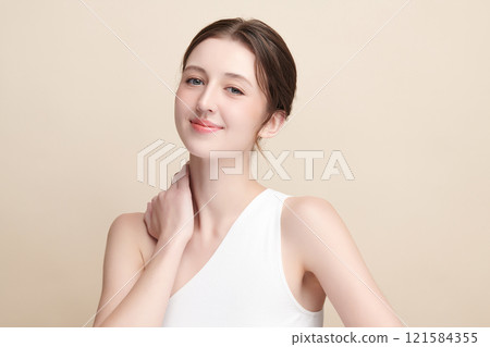 Beautiful young woman with clean fresh skin on beige background, Face care, Facial treatment, Cosmetology, beauty and spa, women portrait. 121584355