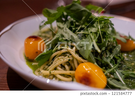 Pesto Spaghetti served on plate in the restaurant Pesto Spaghetti served on plate in the restaurant 121584777
