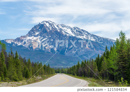 Icefields Parkway (Alberta Highway 93) in Jasper National Park, Alberta, Canada. Canadian Rockies summer landscape. Mount Hardisty in the background. Icefields Parkway (Alberta Highway 93) in Jasper National Park, Alberta, Canada. Canadian Rockies summer landscape. Mount Hardisty in the background. 121584834
