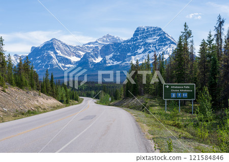 Road sign to Athabasca Falls on Icefields Parkway (Alberta Highway 93) in Jasper National Park, Alberta, Canada. Canadian Rockies summer landscape. Mount Fryatt and Geraldine Peak in the background. Road sign to Athabasca Falls on Icefields Parkway (Alberta Highway 93) in Jasper National Park, Alberta, Canada. Canadian Rockies summer landscape. Mount Fryatt and Geraldine Peak in the background. 121584846